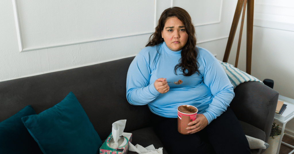 Woman stress eating ice cream after a long day%22